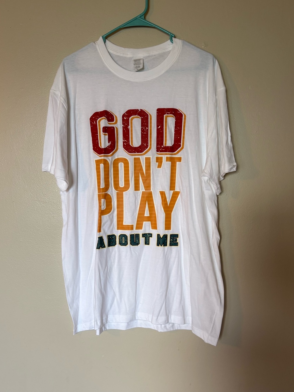 Graphic Tee "GOD DON'T PLAY ABOUT ME" - White with Red, Yellow, Green Print - Picture 1 of 3